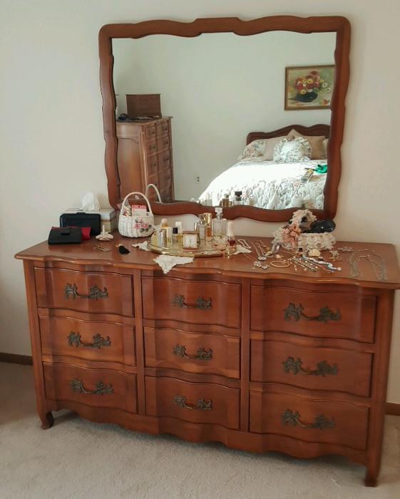Antique Dresser with an Antique Mirror hanging overtop