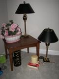 side table, decorative boxes, small green fun lamp, large painted ceramic bowl