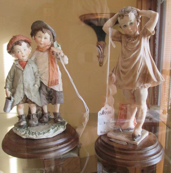 G. Armani figurines