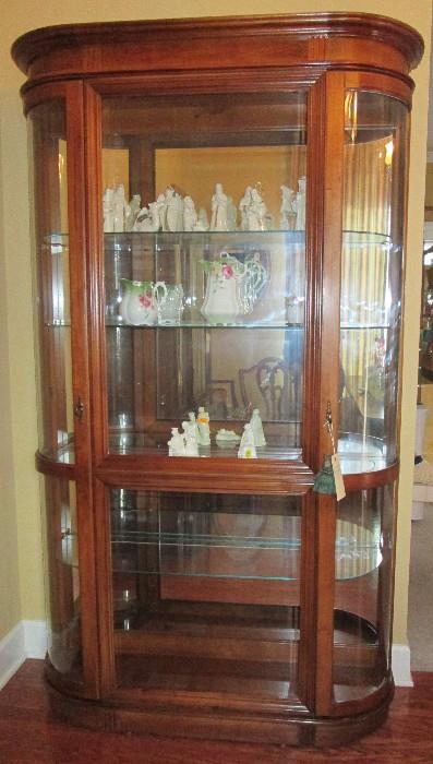 Curved sided lighted display cabinet
