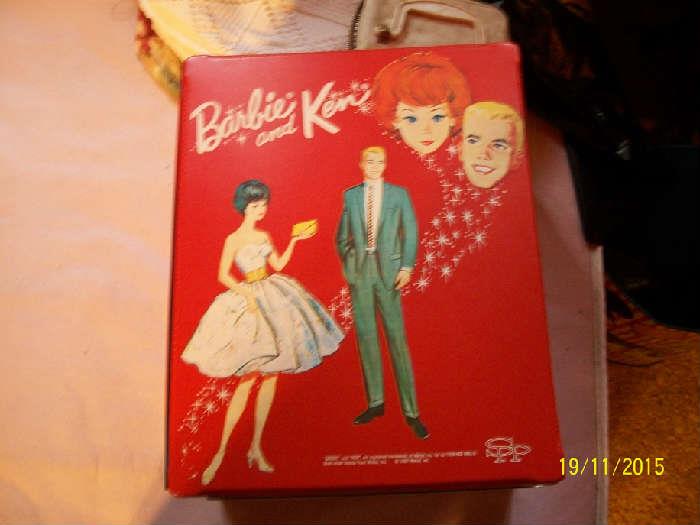 Barbie and Ken dolls with case and accessories