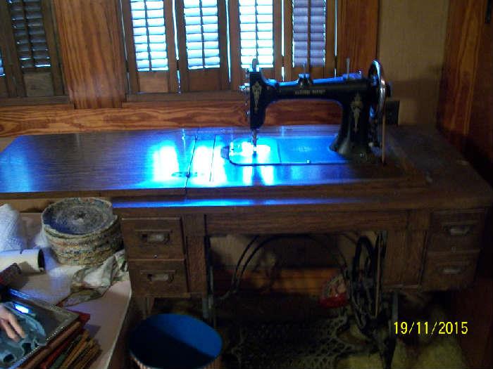 Antique National Rotary sewing machine with cabinet and accessories