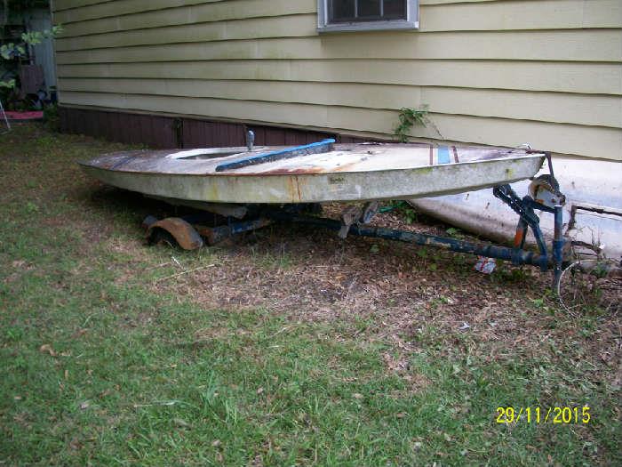 Small sailboat with trailer and sail