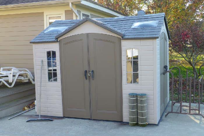 Large vinyl shed. must be moved and may need to be disassembled by buyer 