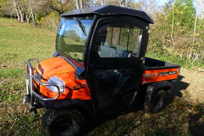 Kubota RTV900X7 Diesel 4 x 4 Like NEW showing only 66.4 hours. Power steering and dump truck rear and front winch and brush guards. MINT