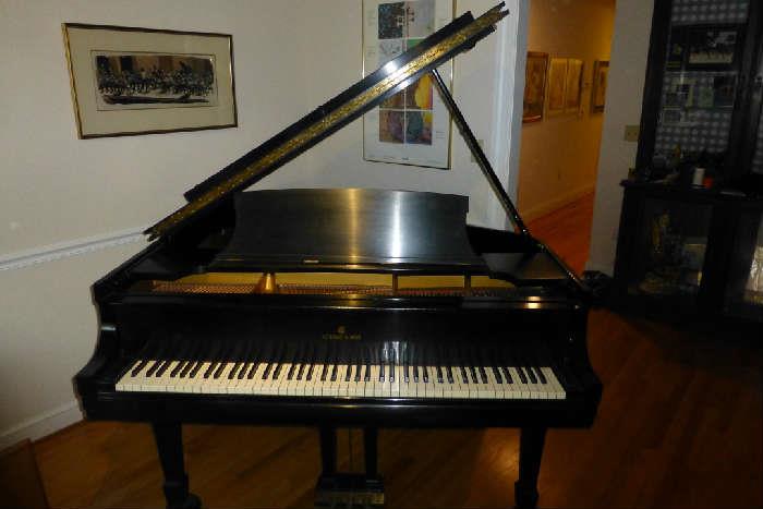 Virtually mint Steinway & Sons baby grand piano with genuine ivory keys. Professionally serviced and tuned each and every year.