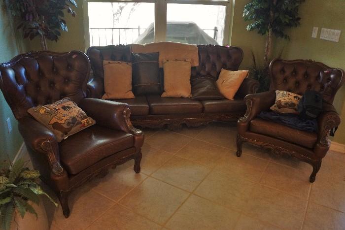 Leather sofa and matching chairs. Purchased from an auction at the Pearl brewery