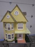Doll house with swivel base, even has a key to the front door.  Furniture sold separately