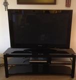 Panasonic 2007 50" 1080p plasma TV. Black TV stand is 4'10" wide. 