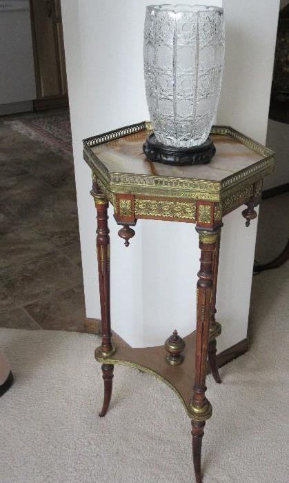 detailed tri leg turned table with brass accents