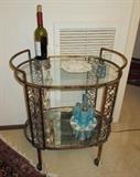brass ornated serving cart w/ glass shelves