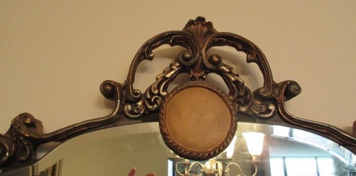 long ornate beveled mirror