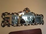 long ornate beveled mirror