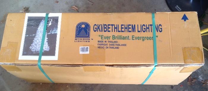 New in box 7.5 foot pre-lit georgeous white artificial Xmas tree by GKI lighting.