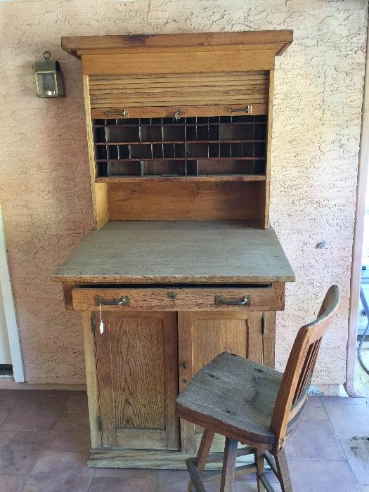 a wonderful antique ticket depot cabinet with swivel chair
