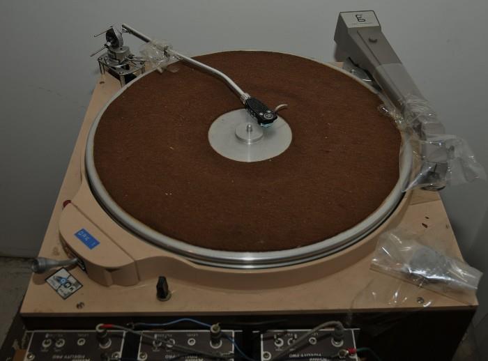 Here is a QRK 12C and a Russco Cue-Master broadcast turntable. These models were made from the early '60's until the early '90's and were in almost all radio stations until the CD and other digital formats became popular. Back then, music was obtained from records and most stations had at least two turntables in the studio. One for playing the first record and the next record would be cued up on the 2nd turntable. Back then, there was no computer, no satellite feed, etc.
