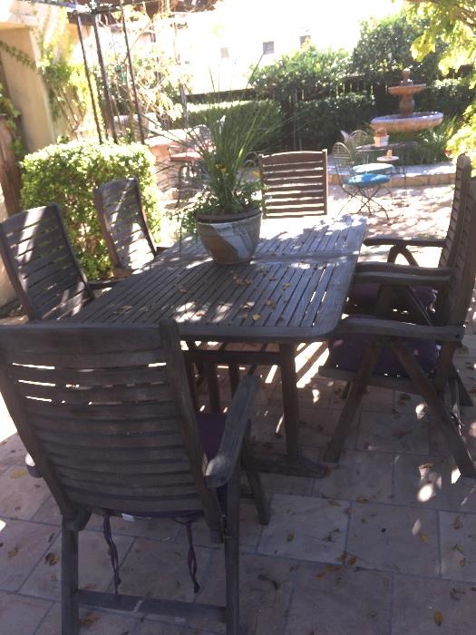 Great weathered teak dining table with leaf and 8 arm chairs.  Very nice!