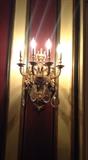 Two pairs of bronze sconces with crystal drops