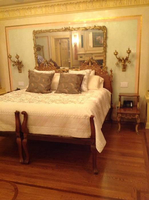Pair of French style twin beds used as a kingsize bed, pair of bronze sconces