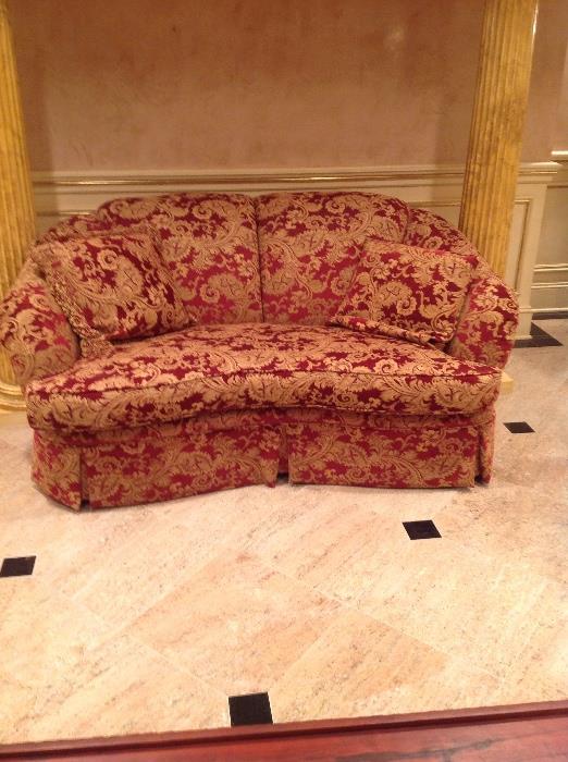 Red and gold damask sofa and matching loveseat