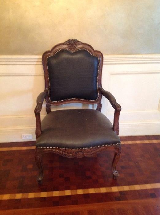One of a pair of embossed leather French style chairs
