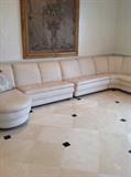 Modern leather sectional and large  urn of flowers painted on canvas