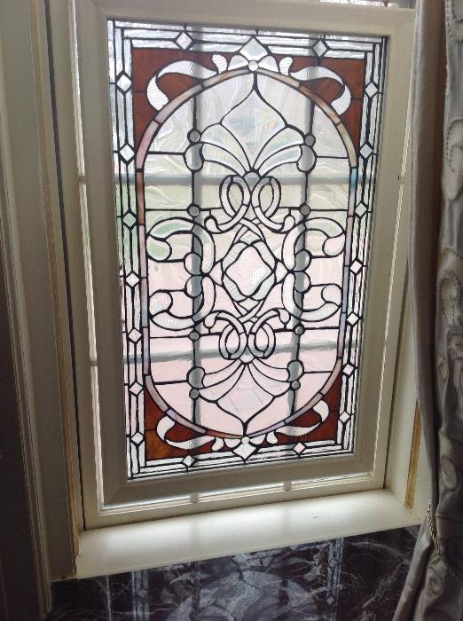 One of a pair of leaded glass windows