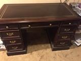 Hekman solid wood desk. With leather top inlay.