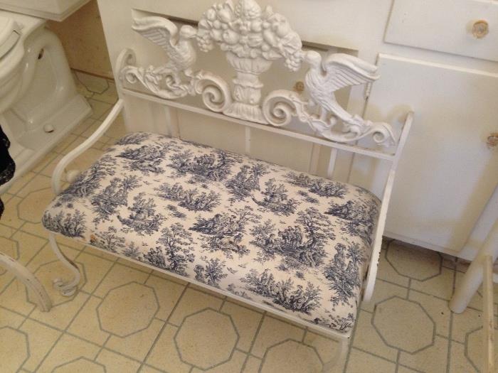 antique iron bench, beautifully upholstered
