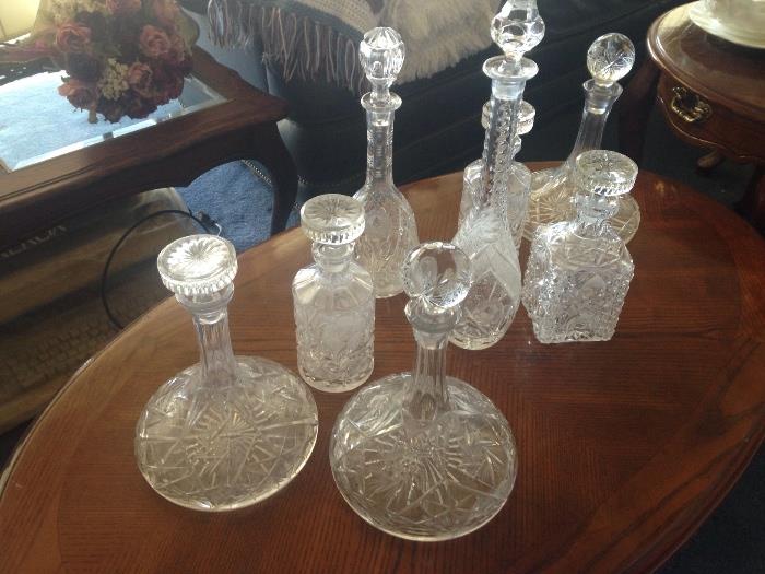 large collection of beautiful crystal decanters