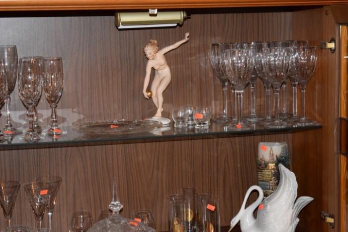 Wall unit has a lighted display area and pull down bar. Bar is not open in this picture.  Hutchenrueter Figurine