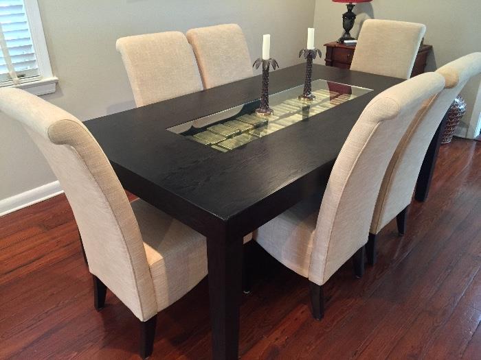 Contemporary dining table and upholstered chairs. 