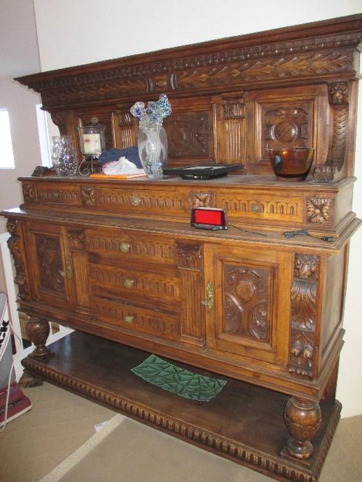 This Massive Server was hand carved in Belgium during the 1800's.  It has a matching piece, the Buffet as well.  This piece is 6 feet 2 inches long, 6 feet 2 inches high and 21 inches deep.  It holds an amazing amount of linens, glasses, silverware, etc..