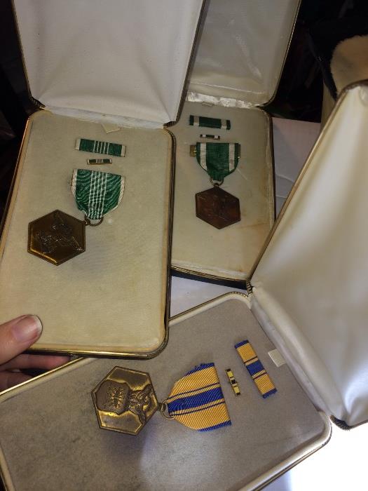 Vintage boxed military medals.