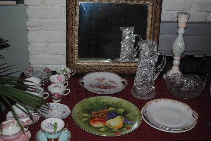 Porcelain tea cups, plates, cut glass pitcher, bowl