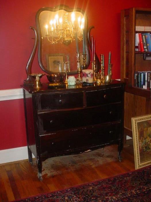 Antique dresser with mirror, and a large beautiful area rug below