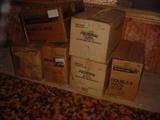 Boxes and boxes of shotgun wads, and other loading supplies, including primers, powder, empty shell casings, and more