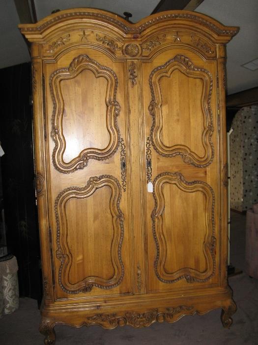 This over-sized Armoire stands 80" high and is 42"wide.