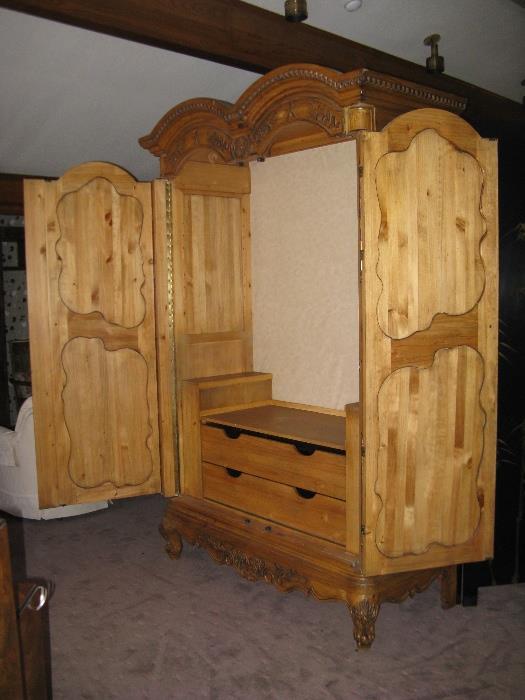 The Armoire can be used as a closet or as a TV/Entertainment Unit.  The doors fold back fully.