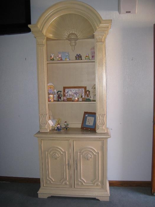 A small 2-piece open curio cabinet.