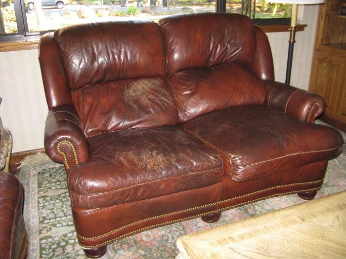 Antiqued Leather Love Seat.