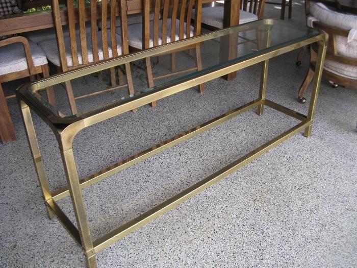 Beautiful Brass and Beveled Glass console table.  there are two matching side tables.