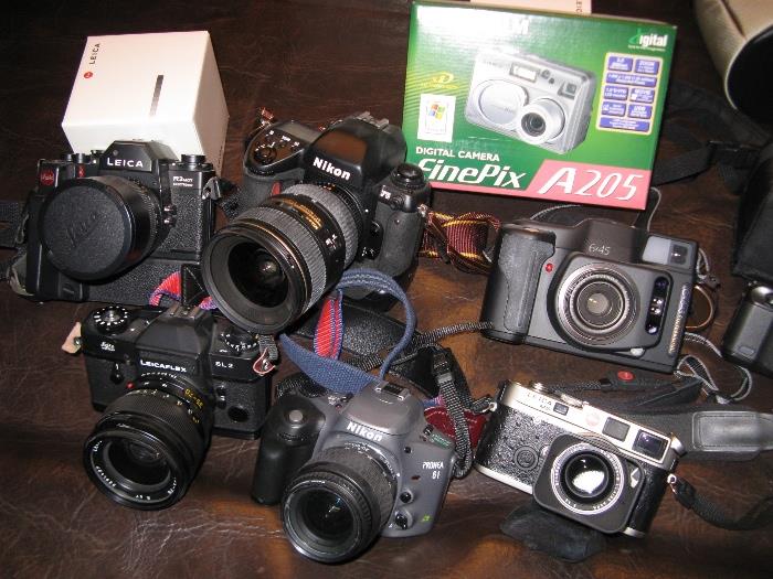 . . . of Cannon, Nikon, Leica, Fujifilm, Minox cameras . . 