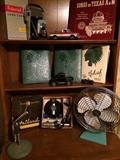 Vintage Waxahachie High School Yearbooks, pop out Polaroid Camera,  Heiland Flash Equipement,  Oscelating Fan, and Microphone.  Also two truck models by the Danbury Mint, Ford Model T and a 1972 Chevrolet Cheyenne pickup 