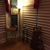 vintage shutter, needle work picture, 3 tall candle sticks, wicker/rattan serving tray, wicker/rattan storage baskets, floor lamp