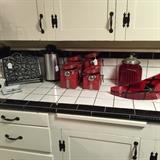 red glass clock, red glass canister, red ceramic canisters, cast iron book holder