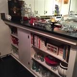 cookbooks, pottery, glass ware, 3 tier stand, small cabinet, misc