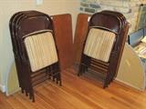 There are four full sets of card table and chairs with round extender tops