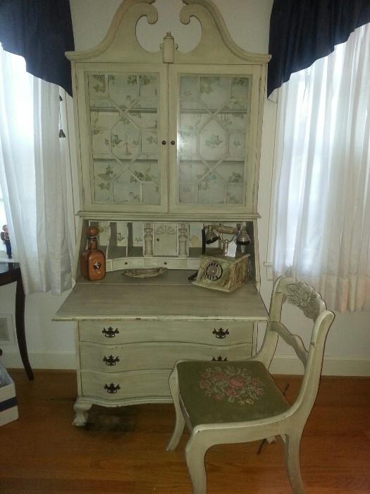 Painted vintage secretary and painted chair with needlepoint seat.