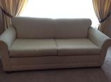 Beige nubby fabric loveseat, sofa bed 
